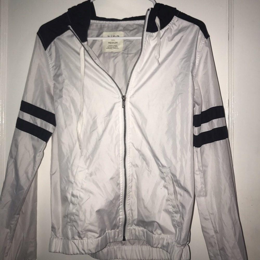 white and black windbreaker